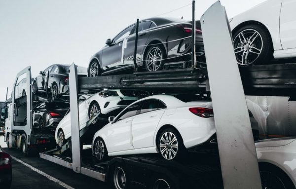 Big car carrier truck of new luxury sport german cars 600x383 1 Smart Ways to Contrast Automobile Transport Quotes Online